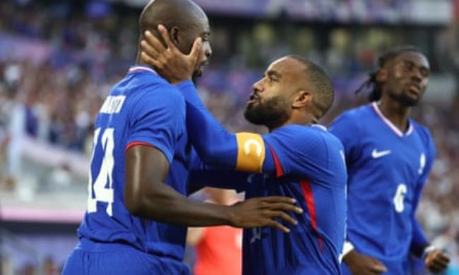 Jean-Philippe Mateta (left) celebrates with Alexandre Lacazette after scoring France’s first goal in the quarter-final win over Argentina.